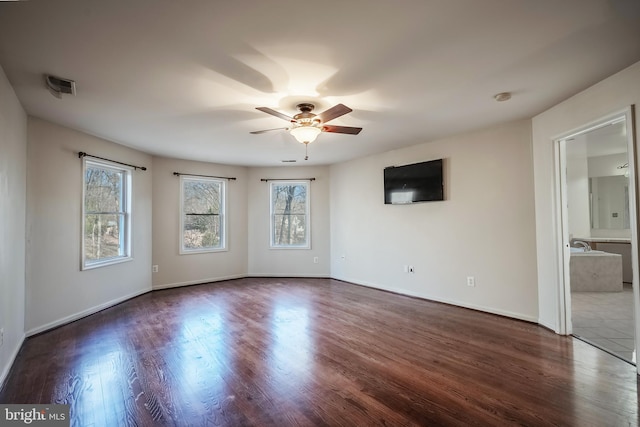 unfurnished room with ceiling fan and dark hardwood / wood-style floors