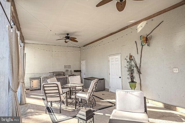 view of patio with ceiling fan and exterior kitchen