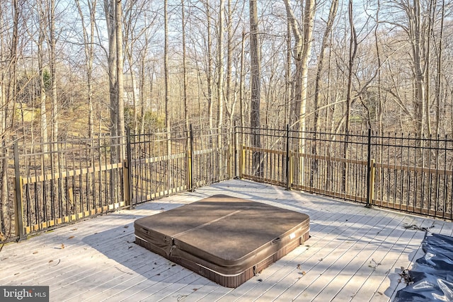 wooden terrace with a covered hot tub