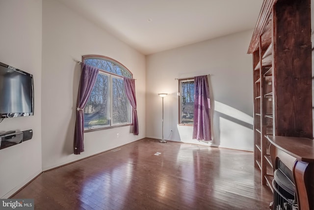 unfurnished living room with hardwood / wood-style flooring