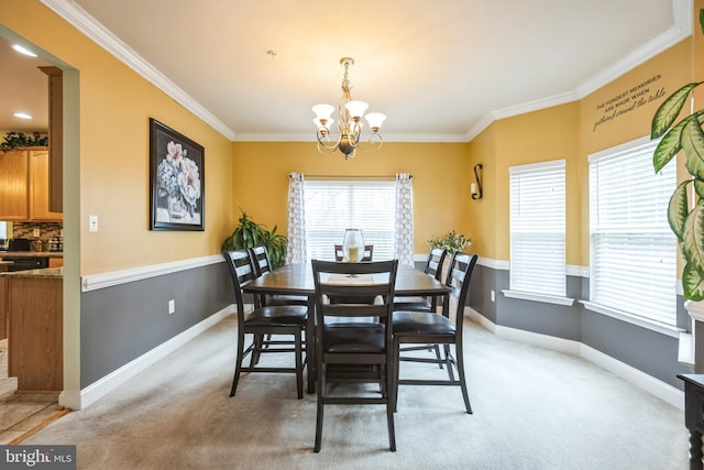 dining room featuring light colored carpet, a chandelier, and ornamental molding