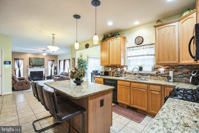 kitchen featuring light tile patterned flooring, sink, backsplash, and black appliances