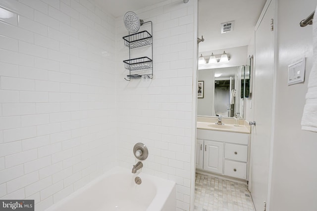 full bathroom featuring tile patterned flooring, visible vents, bathing tub / shower combination, and vanity