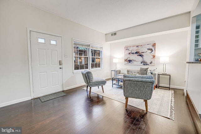 entryway featuring visible vents, baseboards, and wood finished floors