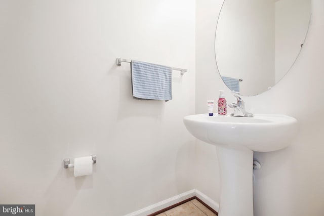 bathroom with tile patterned floors