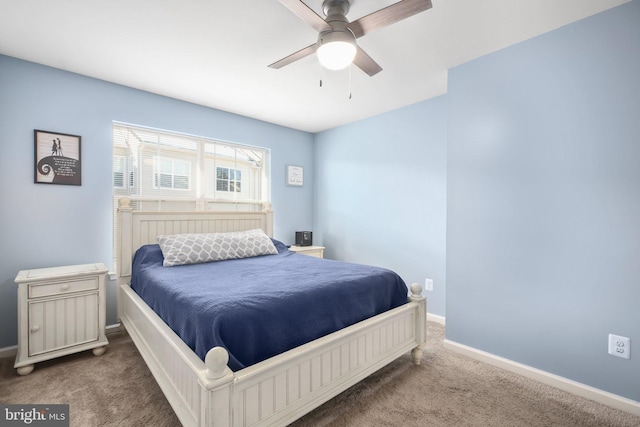 bedroom featuring ceiling fan and carpet