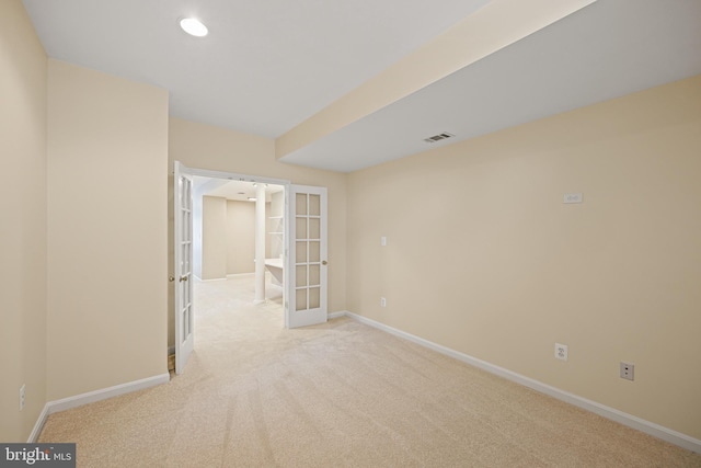 carpeted empty room with french doors