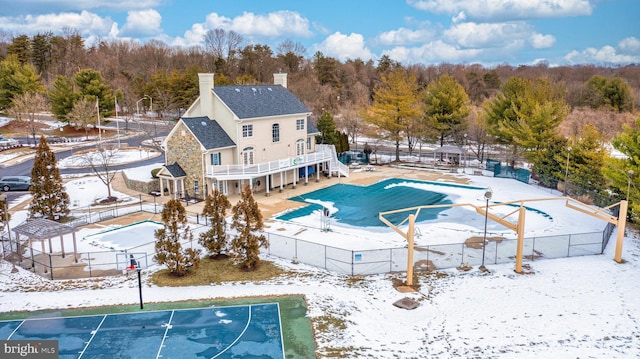 view of snow covered pool