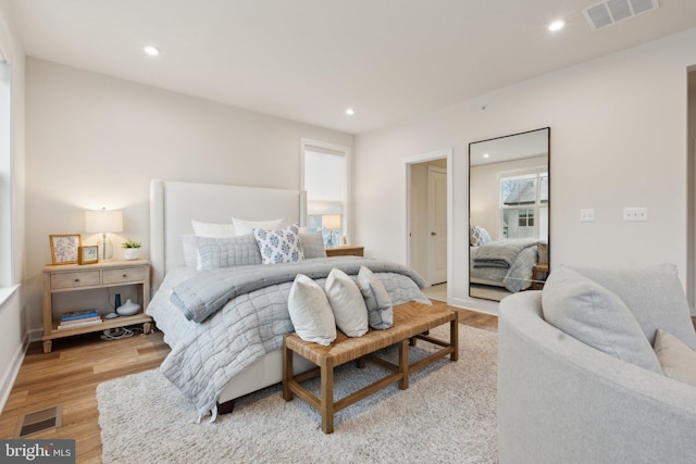 bedroom with light hardwood / wood-style floors