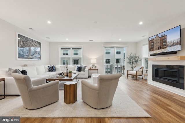 living room with light hardwood / wood-style flooring