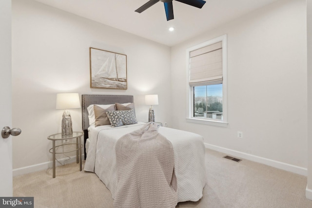 bedroom with light colored carpet and ceiling fan