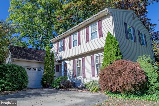 colonial inspired home featuring a garage