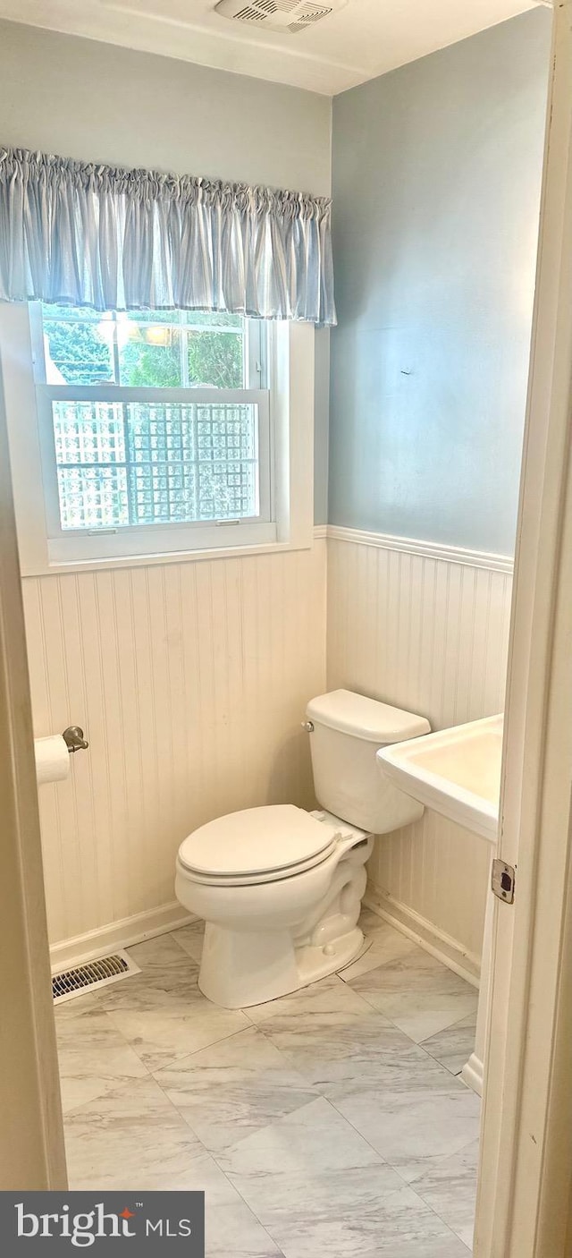 bathroom featuring toilet