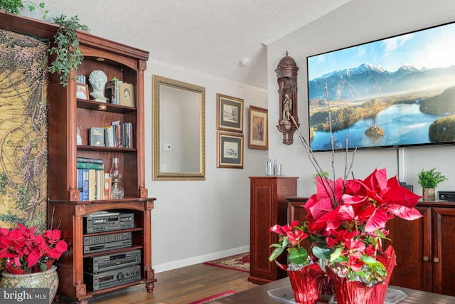 interior space with dark wood-type flooring and crown molding