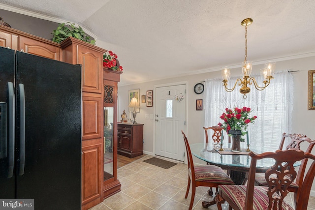 dining area with vaulted ceiling, a wealth of natural light, and crown molding