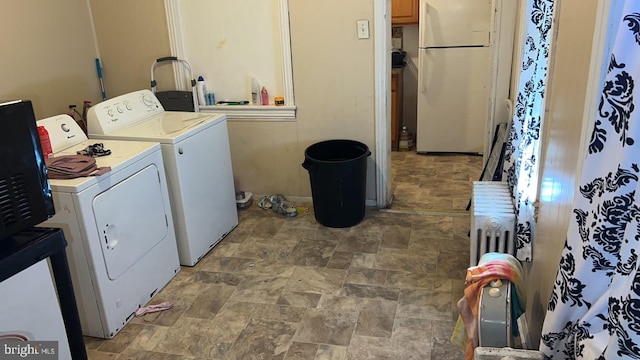 washroom with washer and clothes dryer