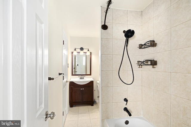 bathroom with tiled shower / bath, vanity, and tile patterned flooring