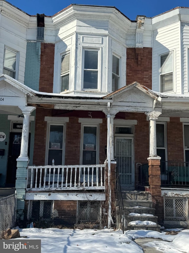 view of front of property featuring covered porch