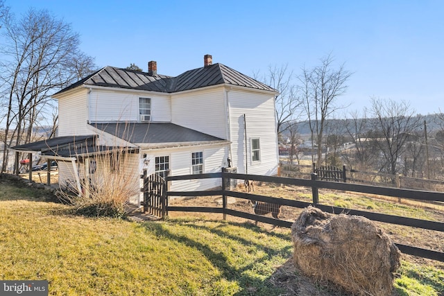 back of house with a yard