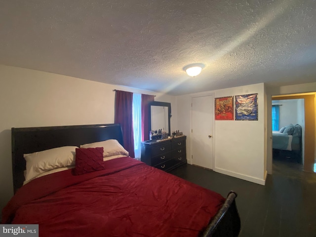 bedroom featuring a textured ceiling