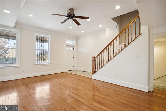 entrance foyer with baseboards, wood-type flooring, stairway, ornamental molding, and recessed lighting