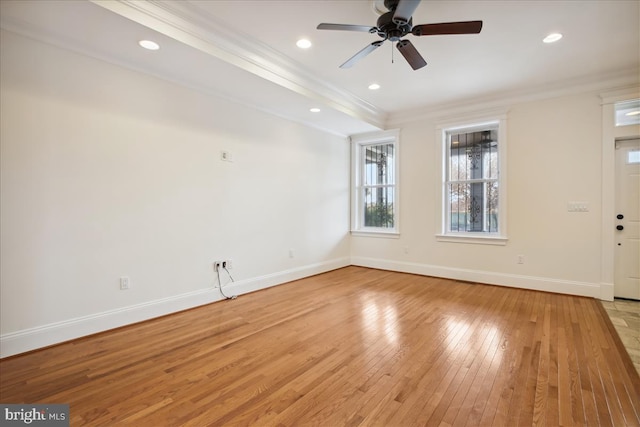 interior space with light wood-type flooring, ceiling fan, and crown molding