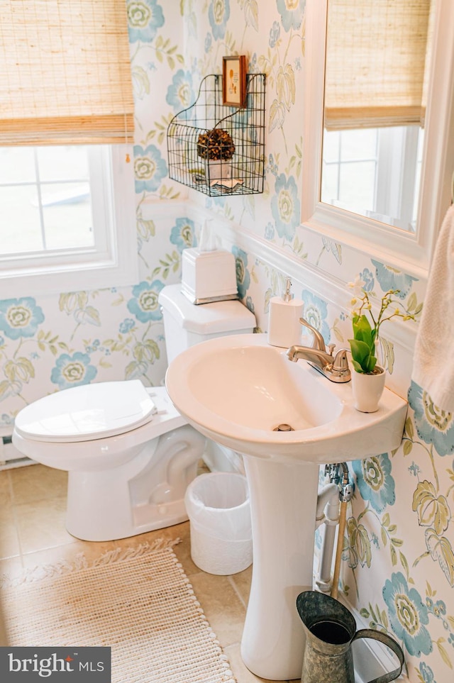 bathroom featuring toilet and tile patterned floors