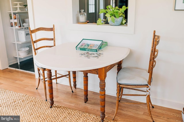 dining area with hardwood / wood-style flooring