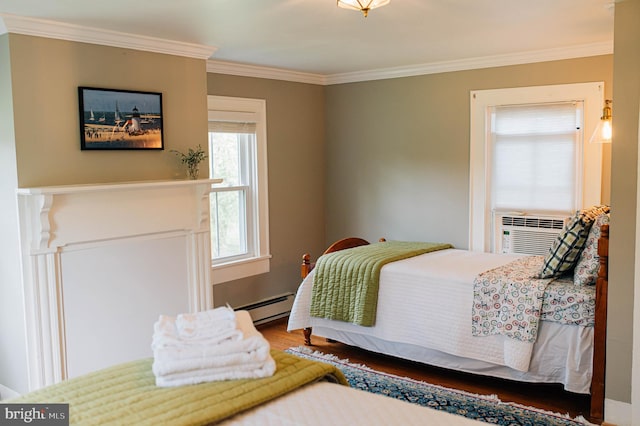 bedroom with a baseboard radiator and ornamental molding