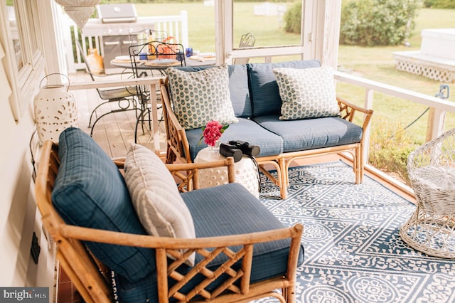 sunroom / solarium featuring an AC wall unit