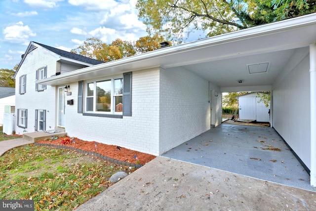 view of property exterior with a carport and a shed