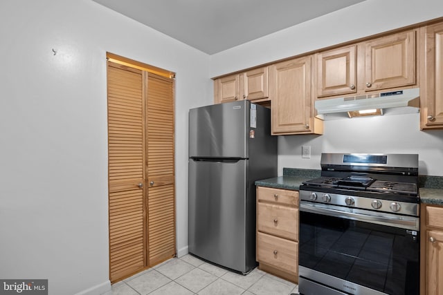 kitchen featuring light brown cabinetry, light tile patterned floors, and stainless steel appliances