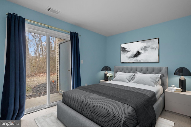 bedroom featuring access to outside, light colored carpet, and multiple windows