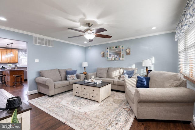 living room with hardwood / wood-style flooring, a wealth of natural light, and ceiling fan