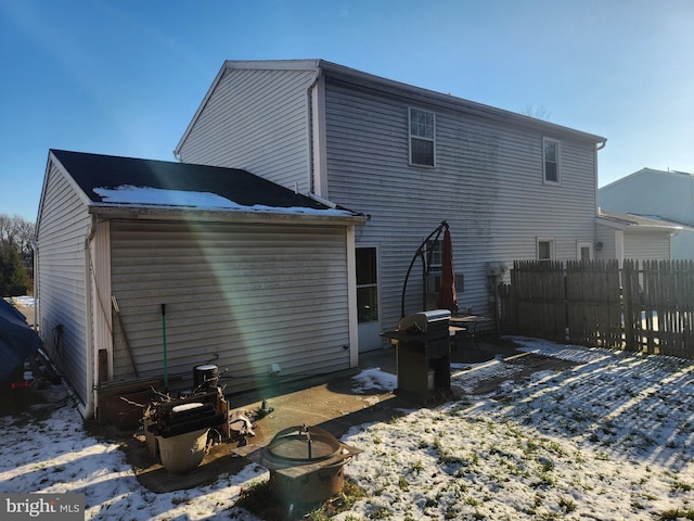 view of snow covered house