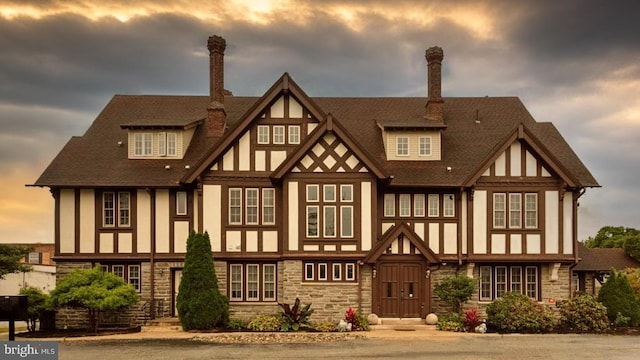 view of back house at dusk