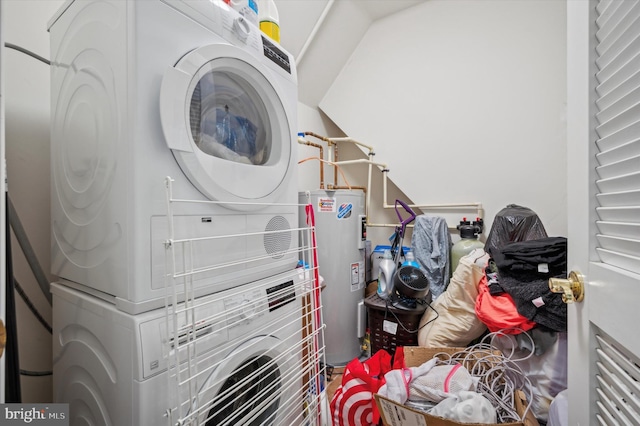 laundry area with stacked washer and dryer and water heater