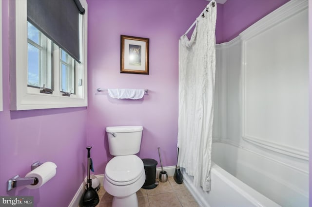 bathroom featuring shower / bath combo, toilet, and tile patterned floors