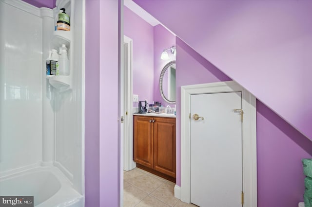 bathroom with tile patterned floors, bathtub / shower combination, and vanity