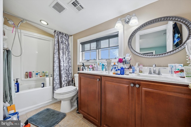 full bathroom featuring tile patterned floors, shower / bath combo with shower curtain, vanity, and toilet