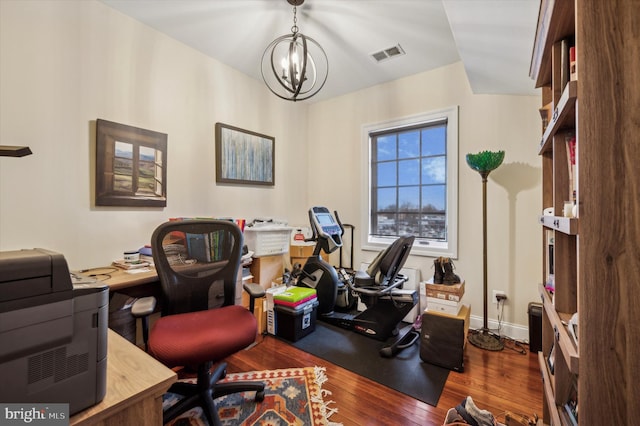 office featuring a chandelier and dark hardwood / wood-style floors