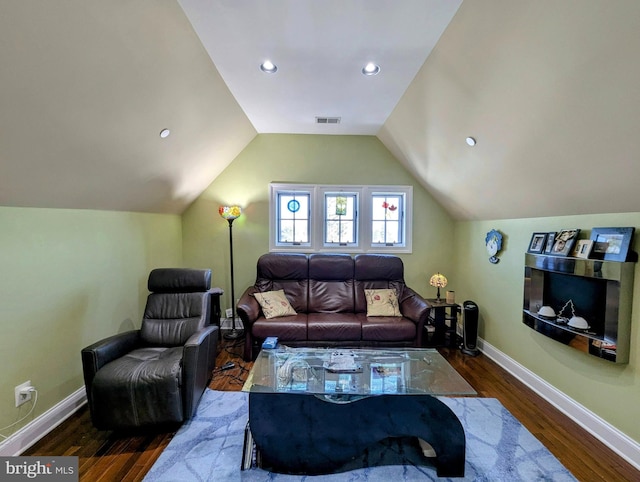 living room with lofted ceiling and dark hardwood / wood-style floors