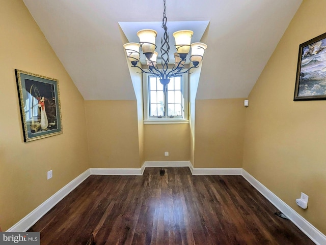 bonus room with lofted ceiling, a chandelier, and dark hardwood / wood-style flooring