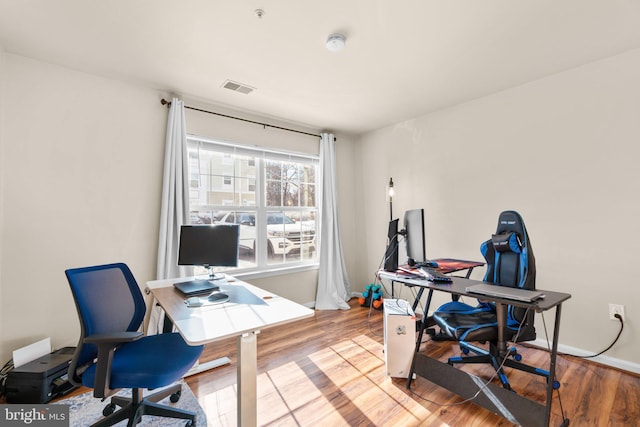 office with hardwood / wood-style flooring