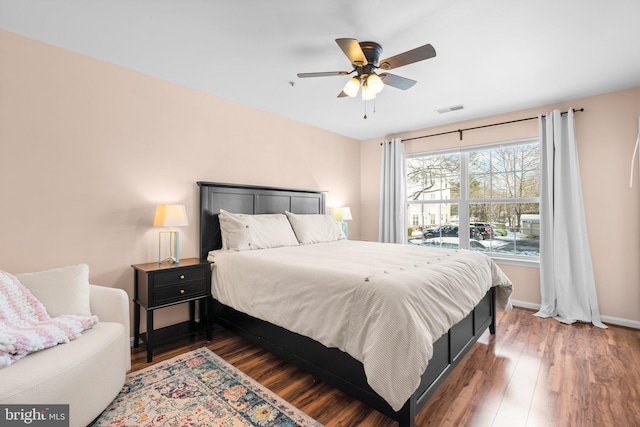 bedroom featuring dark wood-type flooring and ceiling fan