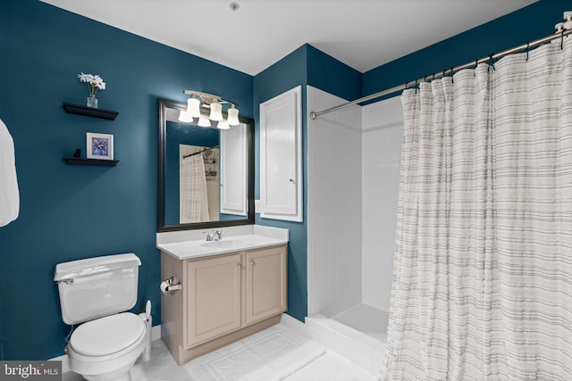 bathroom featuring toilet, tile patterned flooring, walk in shower, and vanity