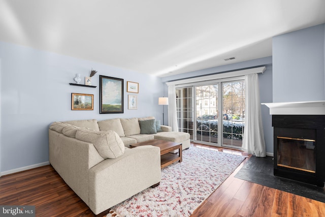 living room featuring dark hardwood / wood-style flooring