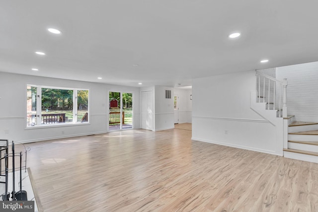 unfurnished living room with light hardwood / wood-style floors