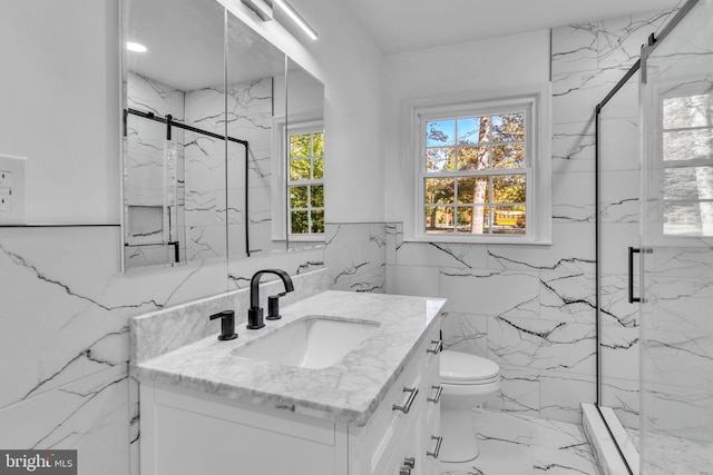 bathroom featuring walk in shower, a wealth of natural light, and vanity