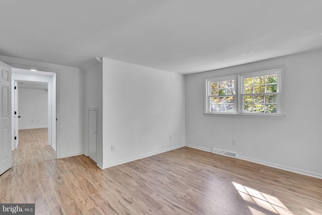 spare room with light hardwood / wood-style floors